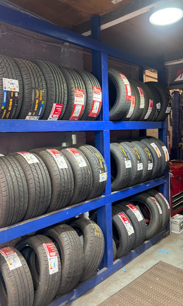 Racks of new tyres in stock at Deans Lane Tyres