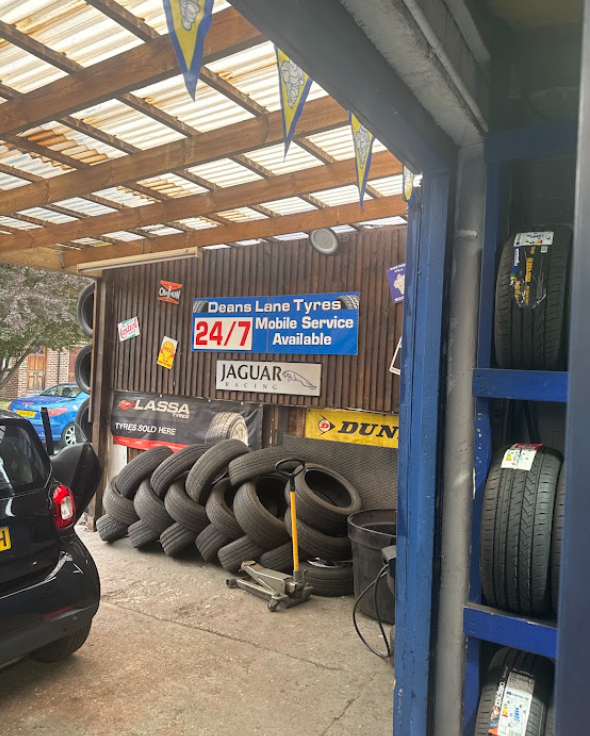 Tyre stock and fitting equipment inside the Deans Lane Tyres bay